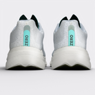 Corredor con zapatillas Zero Minted Ice Monk Performance en carretera – running urbano